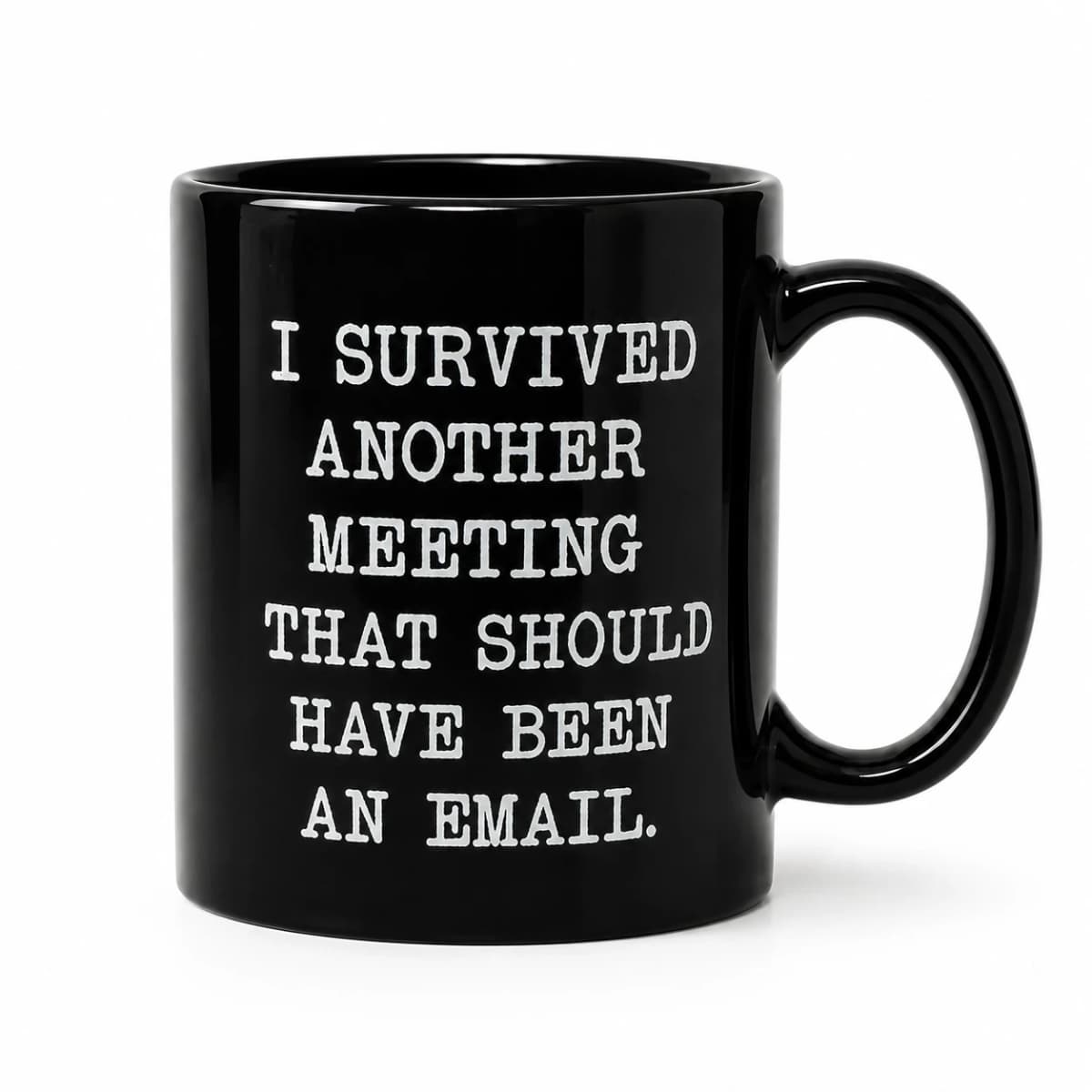 Front studio view of the black ceramic I Survived Another Meeting mug with its full white slogan